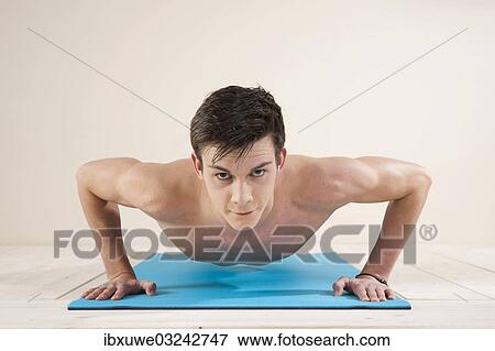 "Young man doing pushups, Mannheim, Baden-Wurttemberg, Germany, Europe" View Large Photo Image Stock Photo - "Young man doing pushups, Mannheim, Baden-Wurttemberg, Germany, Europe". Fotosearch