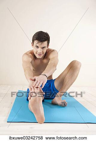 "Young man doing stabilization exercises, Mannheim, Baden-Wurttemberg, Germany, Europe" View Large Photo Image Stock Photo - "Young man doing stabilization exercises, Mannheim, Baden-Wurttemberg, Germany, Europe". Fotosearch