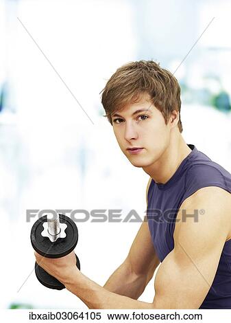 "Young man doing strength training with a dumbbell, muscular" View Large Photo Image Stock Photography - "Young man doing strength training with a dumbbell, muscular". Fotosearch
