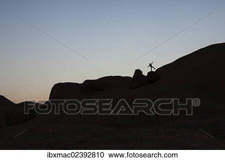 "Young man jumping on a granite rock, near Spitzkoppe granite peaks, Damaraland, Namibia, Africa" View Large Photo Image Stock Image - "Young man jumping on a granite rock, near Spitzkoppe granite peaks, Damaraland, Namibia, Africa". Fotosearch