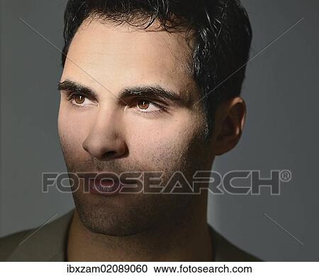 "Young man lit by sunlight, portrait" View Large Photo Image Stock Image - "Young man lit by sunlight, portrait". Fotosearch