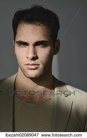 "Young man lit by sunlight, portrait" View Large Photo Image Stock Photo - "Young man lit by sunlight, portrait". Fotosearch