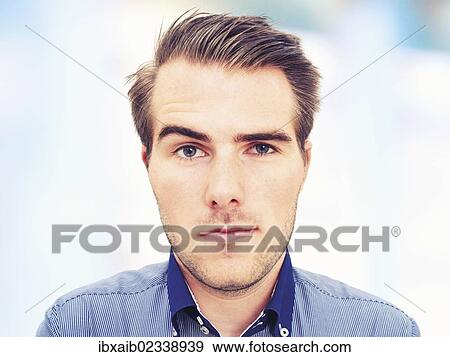 Stock Photo - "Young man, portrait, sceptical face". Fotosearch