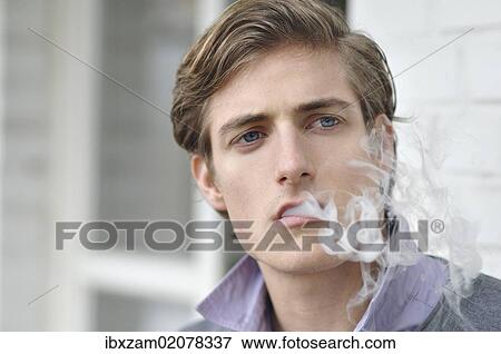 "Young man, smoking, portrait" View Large Photo Image Stock Photo - "Young man, smoking, portrait". Fotosearch