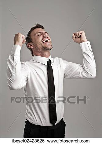 "Young man wearing a shirt and a tie cheering, success, victory pose" View Large Photo Image Stock Photograph - "Young man wearing a shirt and a tie cheering, success, victory pose". Fotosearch