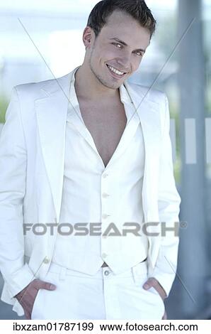 Stock Photo - "Young man wearing a white suit, smiling". Fotosearch