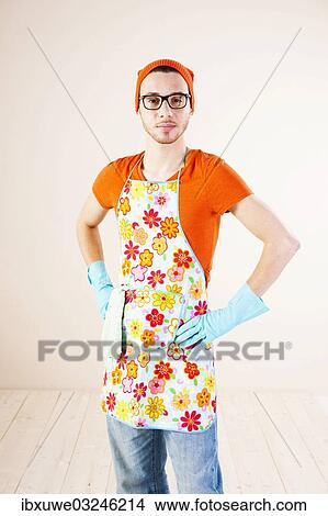 "Young man wearing an apron and cleaning gloves, Mannheim, Baden-Wurttemberg, Germany, Europe" View Large Photo Image Picture - "Young man wearing an apron and cleaning gloves, Mannheim, Baden-Wurttemberg, Germany, Europe". Fotosearch