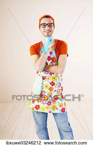 "Young man wearing an apron and cleaning gloves, Mannheim, Baden-Wurttemberg, Germany, Europe" View Large Photo Image Stock Image - "Young man wearing an apron and cleaning gloves, Mannheim, Baden-Wurttemberg, Germany, Europe". Fotosearch