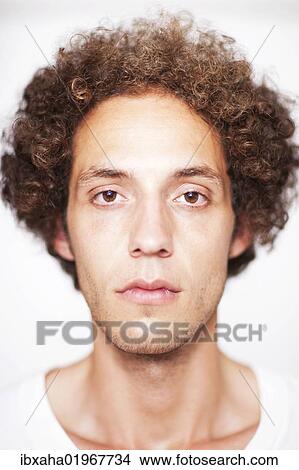 "Young man with curly hair, portrait" View Large Photo Image Picture - "Young man with curly hair, portrait". Fotosearch