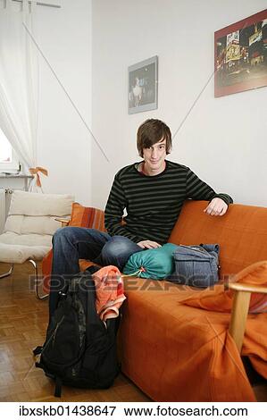 Young man with overnight utensils View Large Photo Image Stock Photo - Young man with overnight utensils. Fotosearch
