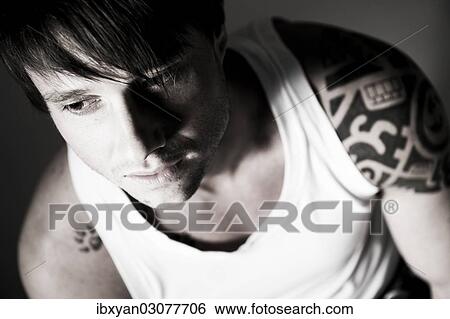 Young man with tattoos View Large Photo Image Stock Photograph - Young man with tattoos. Fotosearch