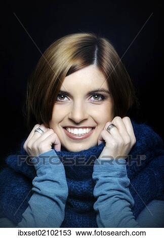 "Young smiling woman wearing a turtleneck sweater, portrait" View Large Photo Image Stock Image - "Young smiling woman wearing a turtleneck sweater, portrait". Fotosearch