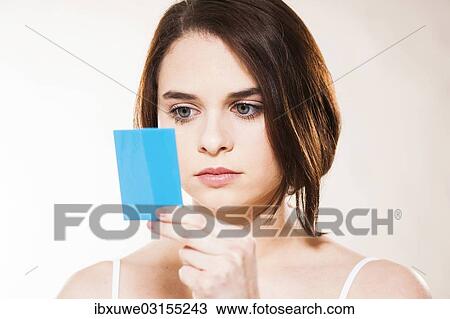 "Young woman applying make-up, Mannheim, Baden-Wurttemberg, Germany, Europe" View Large Photo Image Stock Image - "Young woman applying make-up, Mannheim, Baden-Wurttemberg, Germany, Europe". Fotosearch