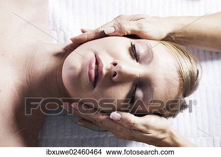 Young woman being treated by a therapist on her head and upper torso View Large Photo Image Picture - Young woman being treated by a therapist on her head and upper torso. Fotosearch