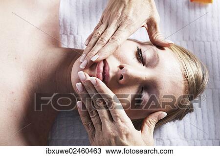 Young woman being treated by a therapist on her head and upper torso View Large Photo Image Stock Image - Young woman being treated by a therapist on her head and upper torso. Fotosearch