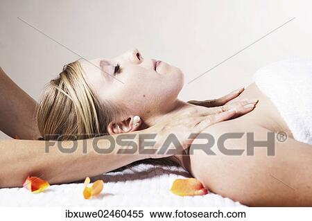Young woman being treated by a therapist on her head and upper torso View Large Photo Image Stock Photography - Young woman being treated by a therapist on her head and upper torso. Fotosearch