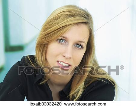 Young woman concentrating View Large Photo Image Stock Image - Young woman concentrating. Fotosearch