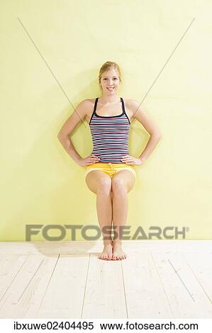 Young woman doing strengthening exercises View Large Photo Image Stock Photography - Young woman doing strengthening exercises. Fotosearch