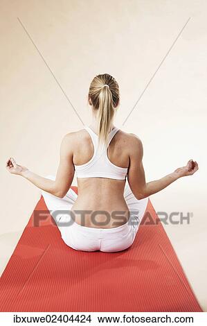 Young woman doing yoga View Large Photo Image Picture - Young woman doing yoga. Fotosearch