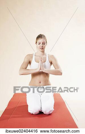 Young woman doing yoga View Large Photo Image Stock Photograph - Young woman doing yoga. Fotosearch