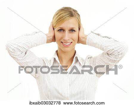 Young woman holding her hands on her ears View Large Photo Image Stock Photo - Young woman holding her hands on her ears. Fotosearch