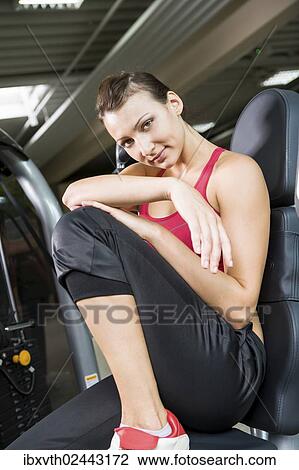Stock Image - Young woman in a gym. Fotosearch