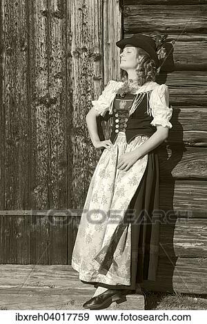 Stock Photo - "Young woman in traditional costume, typical for the region Achensee Tyrolean traditional costume, Achenkirch, Tyrol, Austria, Europe". Fotosearch