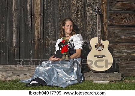 Stock Photo - "Young woman in traditional costume, typical for the region Achensee Tyrolean traditional costume, Achenkirch, Tyrol, Austria, Europe". Fotosearch