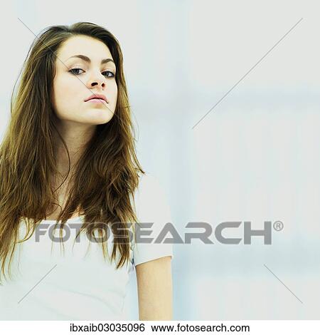 Young woman looking down View Large Photo Image Stock Photograph - Young woman looking down. Fotosearch