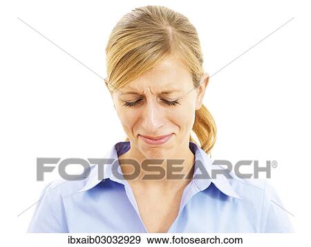 Stock Photo - Young woman looking sad and desperate. Fotosearch