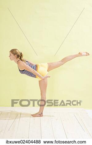 Young woman making a stand scale position View Large Photo Image Stock Photo - Young woman making a stand scale position. Fotosearch