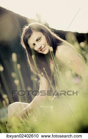 Stock Image - "Young woman, outdoors". Fotosearch
