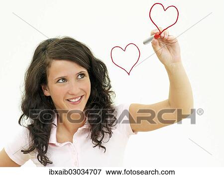 Young woman painting hearts View Large Photo Image Stock Photo - Young woman painting hearts. Fotosearch