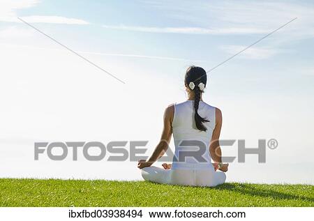 "Young woman practising Hatha yoga, here the pose padmasana, lotus pose" View Large Photo Image Picture - "Young woman practising Hatha yoga, here the pose padmasana, lotus pose". Fotosearch