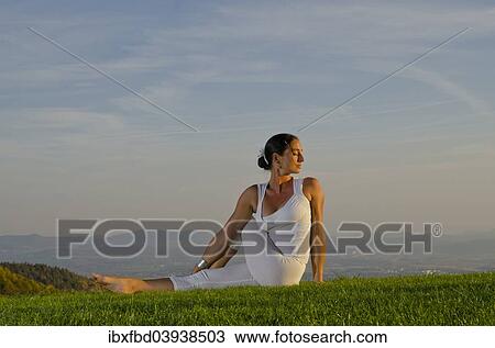 "Young woman practising Hatha yoga, here the pose ardha matsyendrasana, half spinal twist" View Large Photo Image Stock Image - "Young woman practising Hatha yoga, here the pose ardha matsyendrasana, half spinal twist". Fotosearch