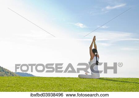 "Young woman practising Hatha yoga, here the pose merudandasana, sitting mountain pose" View Large Photo Image Stock Photograph - "Young woman practising Hatha yoga, here the pose merudandasana, sitting mountain pose". Fotosearch