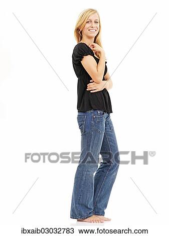 Stock Image - "Young woman, smiling, standing". Fotosearch