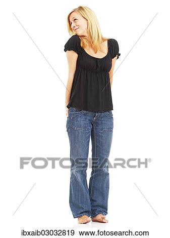 "Young woman, smiling, standing, with a dreamy expression" View Large Photo Image Stock Photo - "Young woman, smiling, standing, with a dreamy expression". Fotosearch