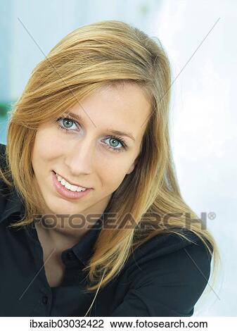 Stock Image - Young woman smiling. Fotosearch