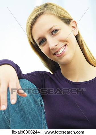 Young woman smiling View Large Photo Image Stock Image - Young woman smiling. Fotosearch