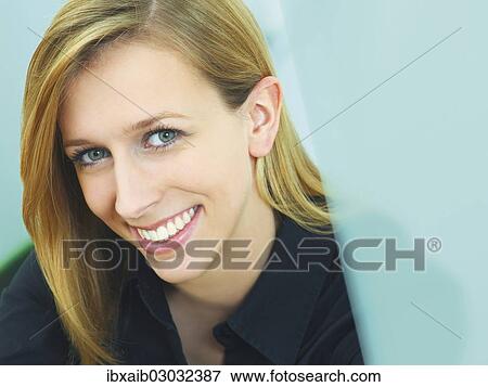 Stock Photo - Young woman smiling. Fotosearch