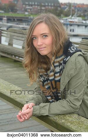 "Young woman standing on a footbridge, Ystad, Sweden, Europe" View Large Photo Image Stock Photo - "Young woman standing on a footbridge, Ystad, Sweden, Europe". Fotosearch
