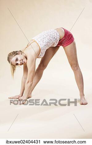 Young woman stretching View Large Photo Image Stock Image - Young woman stretching. Fotosearch