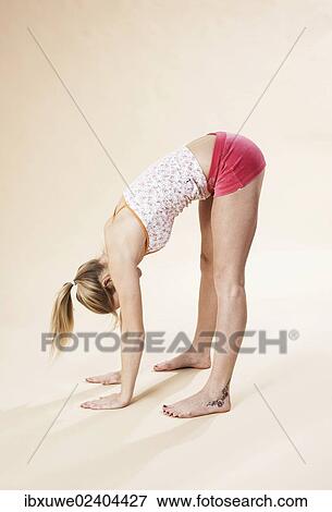 Stock Photo - Young woman stretching. Fotosearch