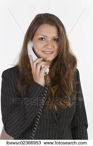 Stock Image - Young woman talking on the phone. Fotosearch