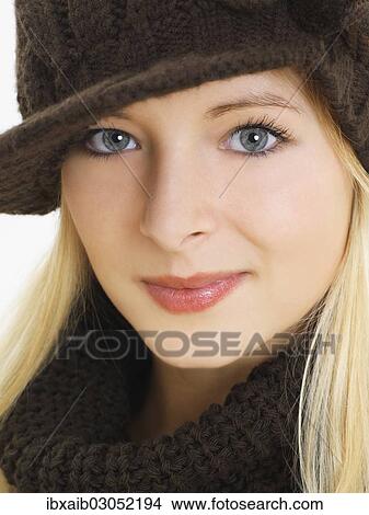 "Young woman wearing a brown hat, portrait" View Large Photo Image Picture - "Young woman wearing a brown hat, portrait". Fotosearch