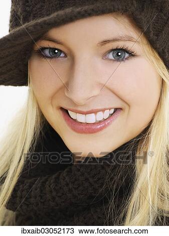 "Young woman wearing a brown hat, portrait" View Large Photo Image Stock Image - "Young woman wearing a brown hat, portrait". Fotosearch