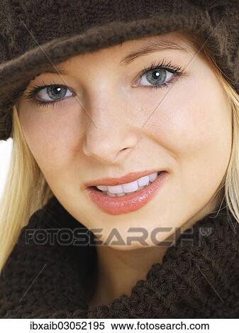 Stock Photography - "Young woman wearing a brown hat, portrait". Fotosearch