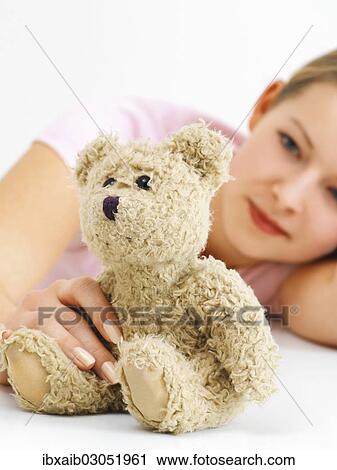 Young woman with a teddy bear View Large Photo Image Stock Image - Young woman with a teddy bear. Fotosearch