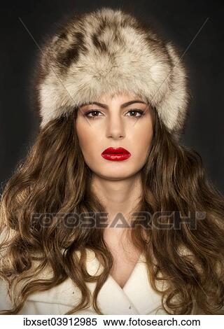Stock Photography - "Young woman with fur hat, portrait". Fotosearch